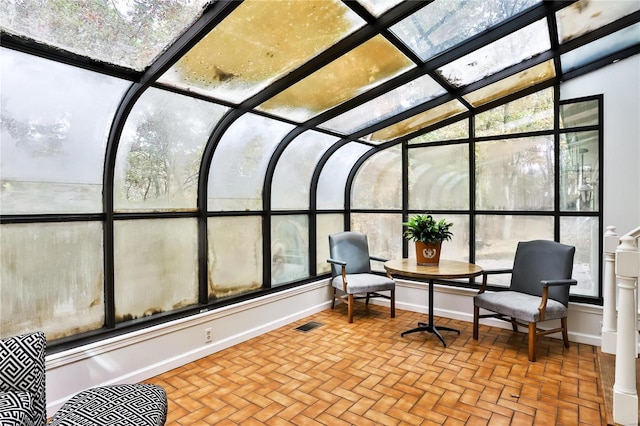 sunroom featuring a wealth of natural light