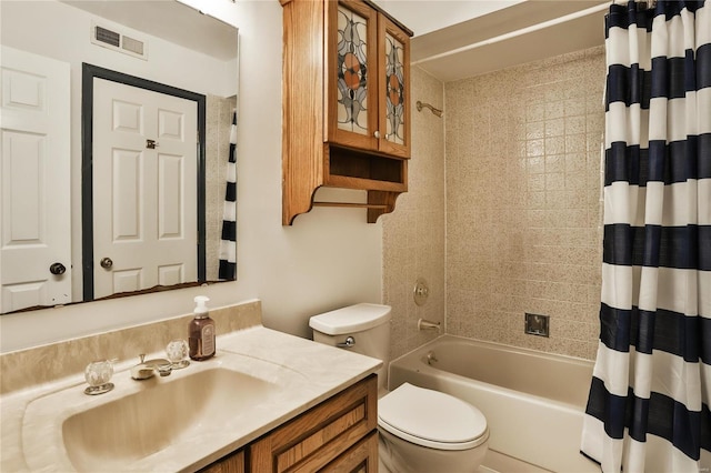 full bathroom with shower / tub combo, vanity, and toilet