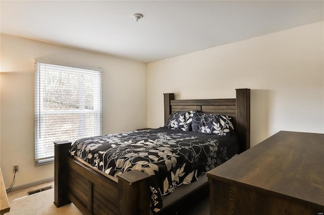 bedroom featuring light colored carpet