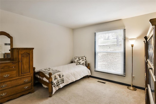 bedroom with light colored carpet