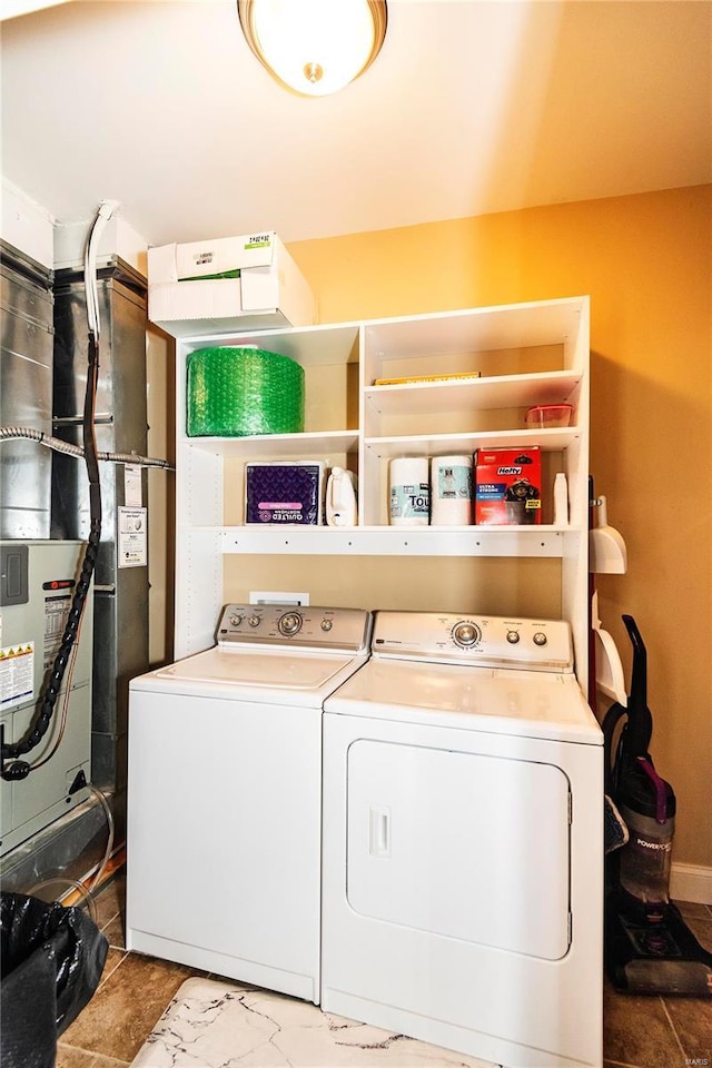 clothes washing area with washer and clothes dryer