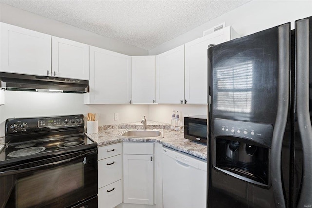 kitchen with sink, light stone counters, black appliances, a textured ceiling, and white cabinets