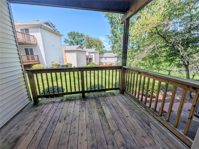 wooden deck featuring a yard