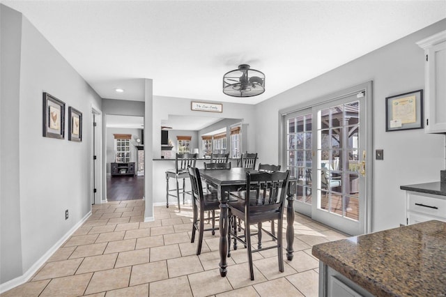 dining room featuring light tile patterned floors and ceiling fan