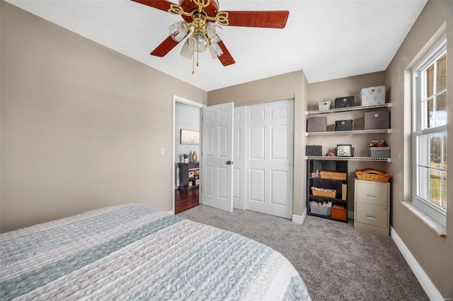 bedroom featuring carpet flooring, ceiling fan, and a closet