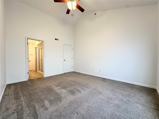 unfurnished bedroom featuring ceiling fan, carpet flooring, and high vaulted ceiling