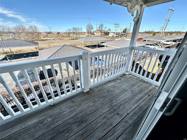 wooden deck with a carport