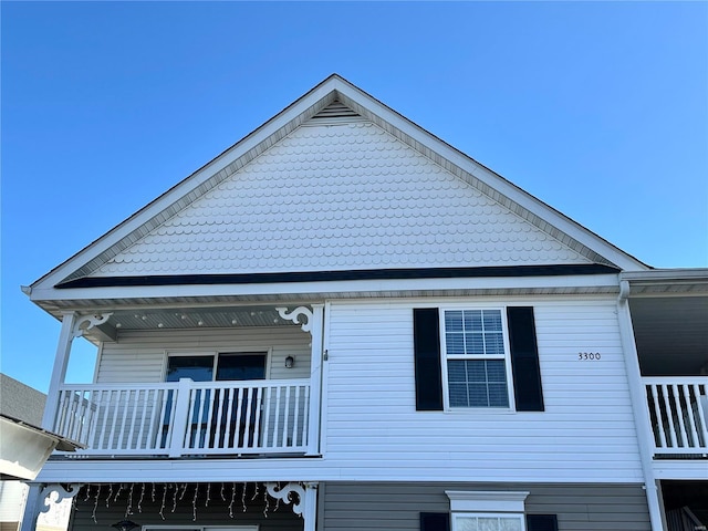 view of side of property with a balcony