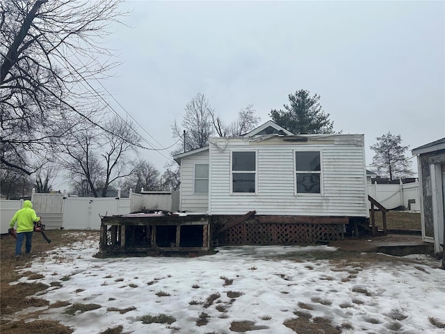 view of snow covered house