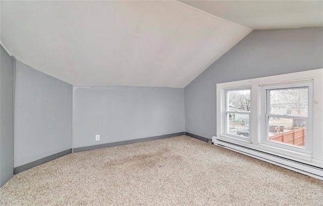 bonus room featuring baseboard heating, lofted ceiling, and carpet floors