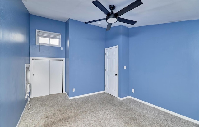 spare room with ceiling fan and carpet floors