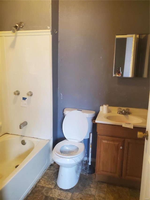 full bathroom with vanity,  shower combination, and toilet