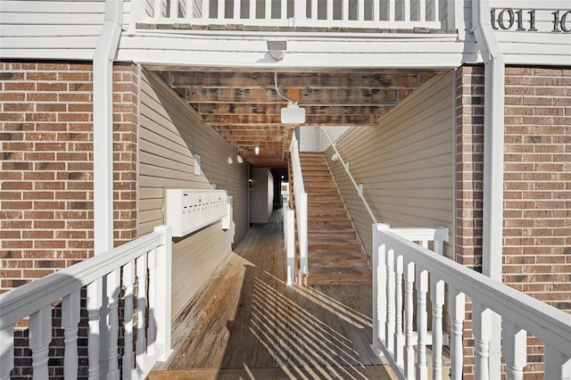 doorway to property featuring brick siding