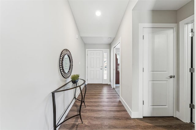 interior space featuring dark wood-style floors and baseboards