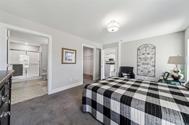 bedroom with baseboards, connected bathroom, a walk in closet, carpet flooring, and a closet