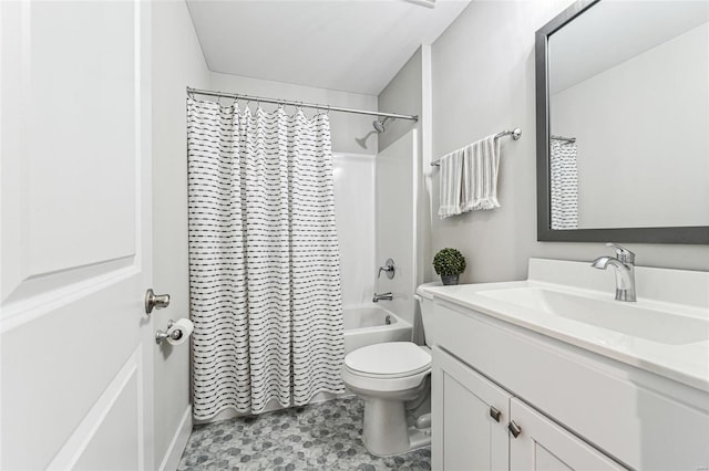 full bathroom featuring shower / bath combo, vanity, and toilet