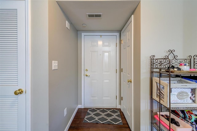 doorway featuring dark wood-type flooring