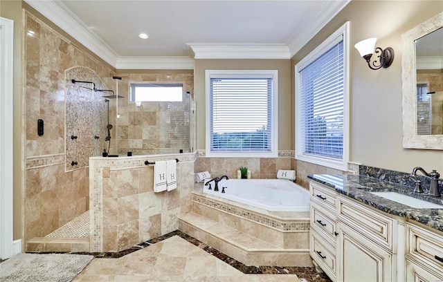 bathroom featuring a healthy amount of sunlight, ornamental molding, separate shower and tub, and vanity