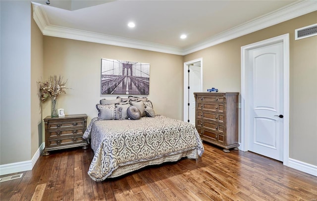 bedroom featuring ornamental molding and dark hardwood / wood-style floors