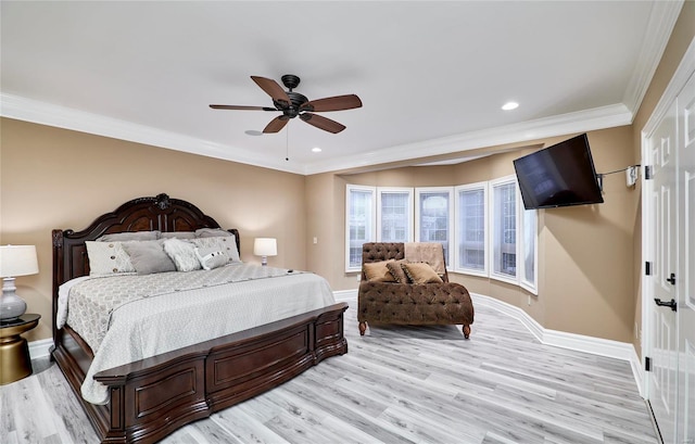 bedroom with crown molding, ceiling fan, and light hardwood / wood-style flooring