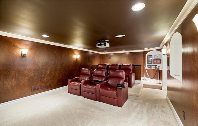 cinema room with light carpet and crown molding