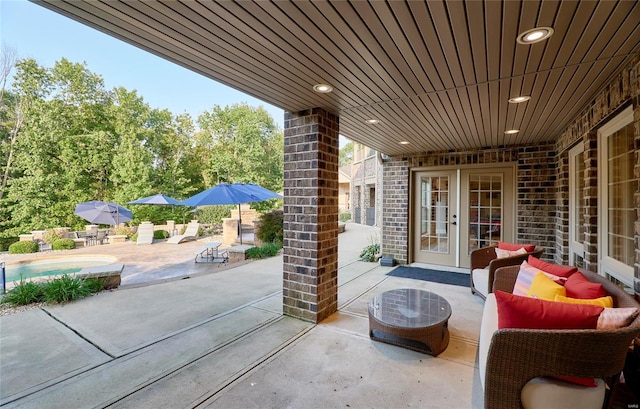 view of patio / terrace with an outdoor living space and french doors