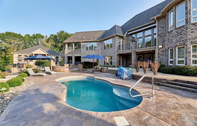 view of pool featuring a patio area