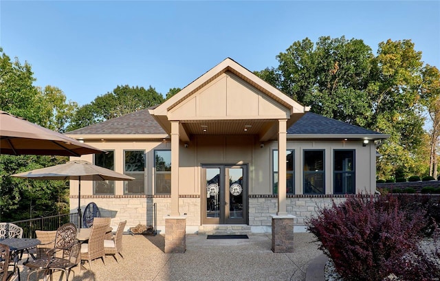 rear view of house with a patio and french doors