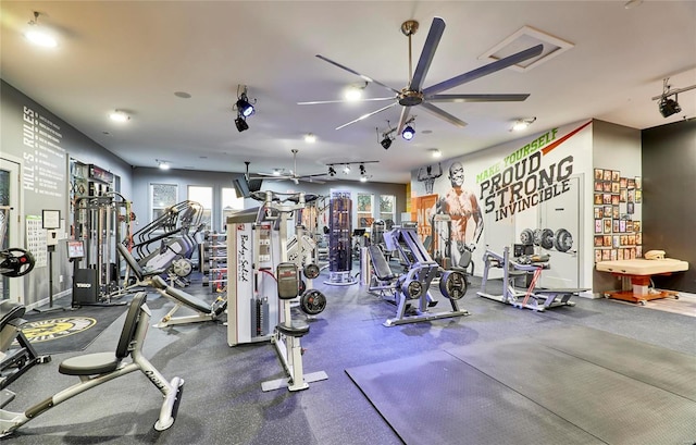 workout area featuring track lighting