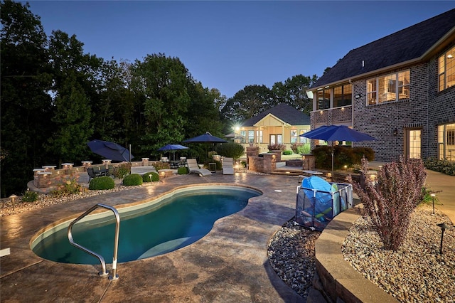 view of swimming pool featuring a patio area