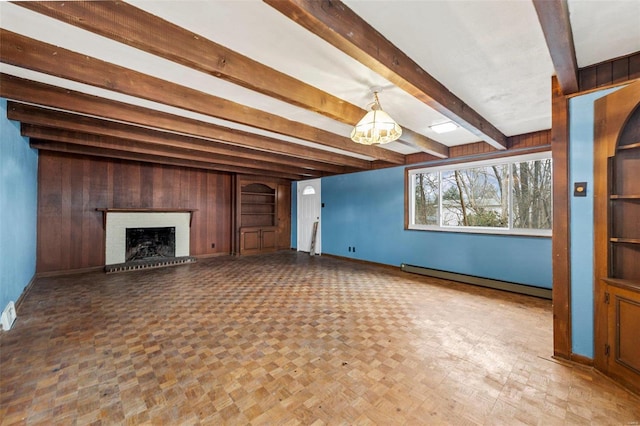 unfurnished living room featuring a brick fireplace, parquet floors, a baseboard radiator, wooden walls, and beamed ceiling