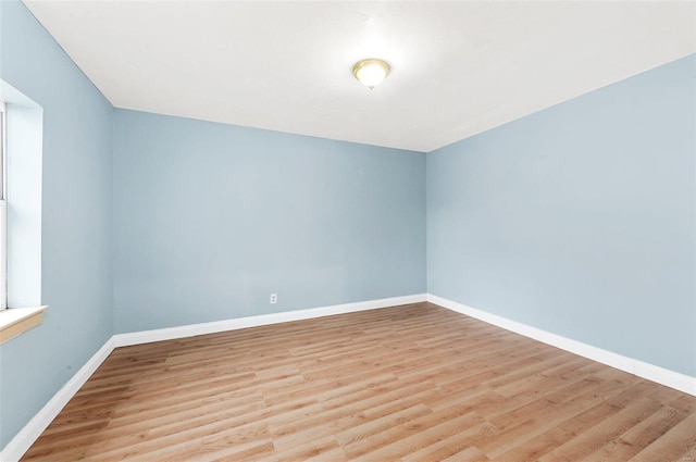 empty room with light wood-type flooring