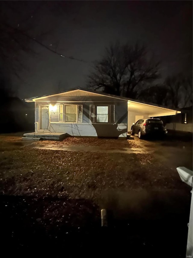 exterior space featuring a carport