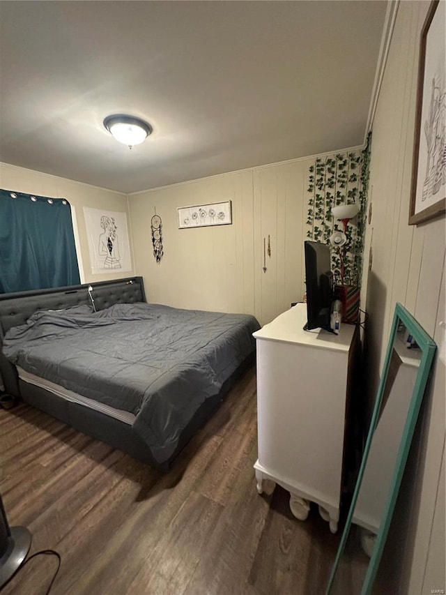 bedroom featuring dark hardwood / wood-style floors