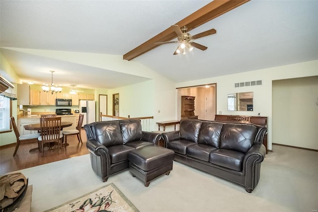 living room featuring sink, ceiling fan with notable chandelier, and lofted ceiling with beams