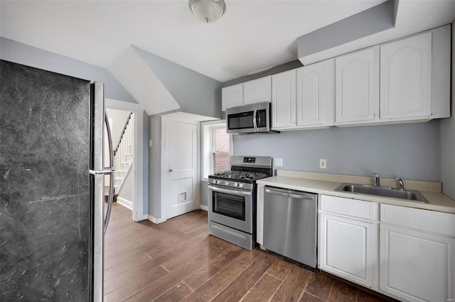 kitchen featuring white cabinetry, sink, dark hardwood / wood-style flooring, and appliances with stainless steel finishes