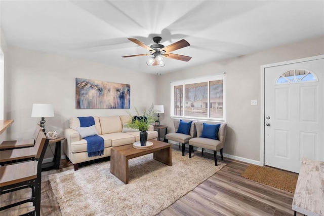 living room with ceiling fan and hardwood / wood-style floors