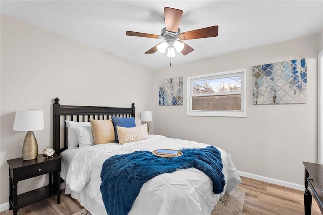 bedroom featuring ceiling fan and light hardwood / wood-style flooring