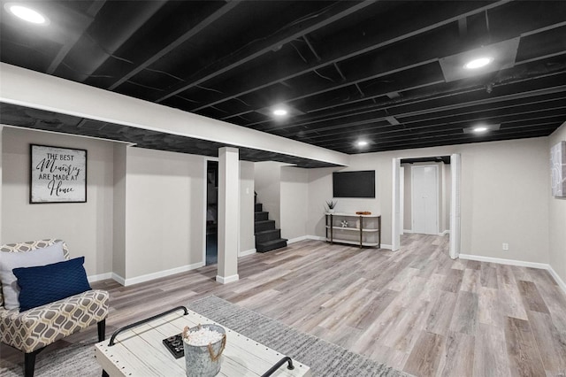 basement featuring hardwood / wood-style flooring