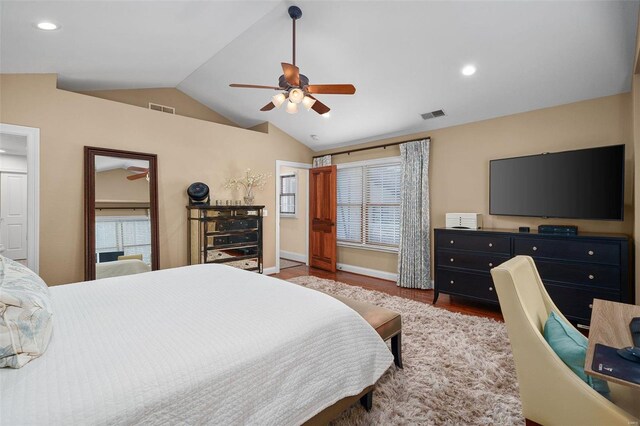 bedroom featuring lofted ceiling, hardwood / wood-style floors, and ceiling fan