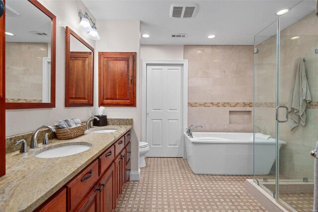 full bathroom featuring toilet, vanity, and shower with separate bathtub