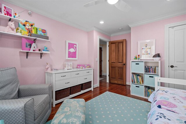 bedroom with dark hardwood / wood-style flooring, ornamental molding, and ceiling fan