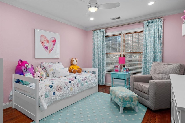 bedroom with ornamental molding, dark hardwood / wood-style floors, and ceiling fan