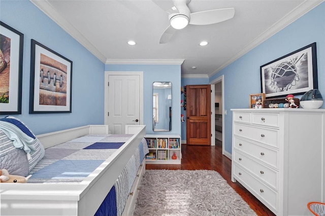 bedroom with ceiling fan, ornamental molding, and dark hardwood / wood-style flooring