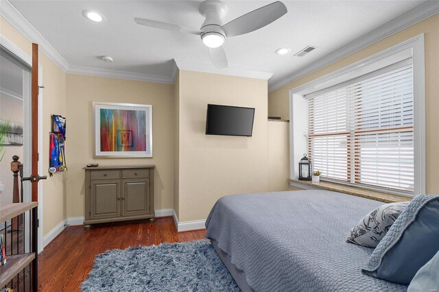 bedroom featuring ceiling fan, ornamental molding, and dark hardwood / wood-style flooring