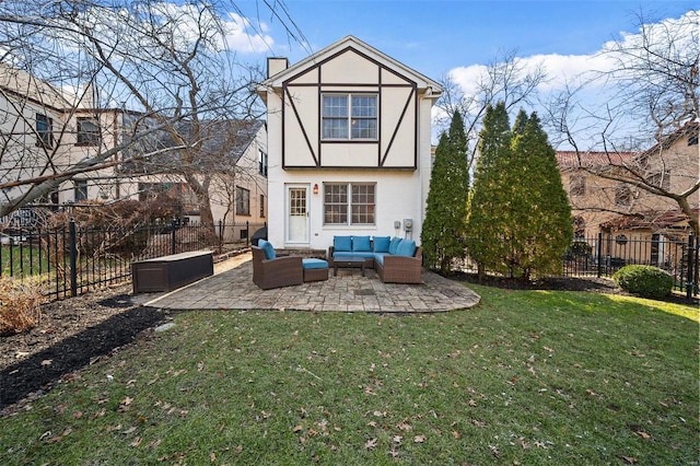 rear view of house featuring an outdoor hangout area, a lawn, and a patio area