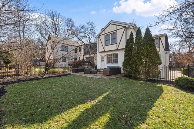 back of property featuring a yard, outdoor lounge area, and a patio