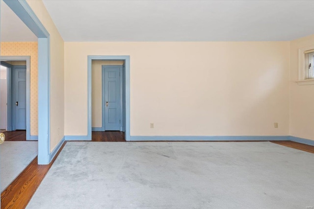 unfurnished room with wood-type flooring