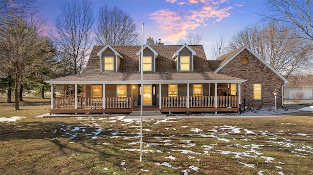 view of front of home featuring a lawn and a porch