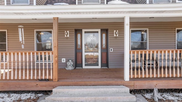 entrance to property featuring a porch